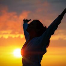 Woman praising, irima / Shutterstock.com
