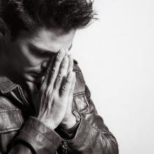 Man praying, KieferPix / Shutterstock.com