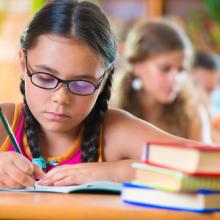 A girl studies in school. Image courtesy Olesya Feketa/shutterstock.com