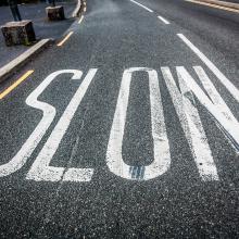 Slow down sign, Semmick Photo / Shutterstock.com