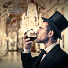 Rich man drinking wine, ollyy / Shutterstock.com