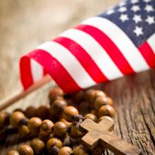 Cross and flag. Image via Jiri Hera/shutterstock.com
