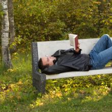 Man reading in the park, dragon_fang / Shutterstock.com