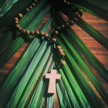 The cross and the palm frond. Image via Muskoka Stock Photos/shutterstock.com