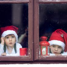 Two boys wait for Santa. Image courtesy Tomsickova Tatyana/shutterstock.com