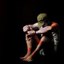 Solider in isolation painted with an American flag. Image courtesy CURAphotograp