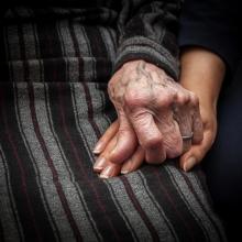 Holding hands in a nursing home Holding hands in a nursing home