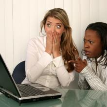Women outraged looking at a computer screen, VanHart / Shutterstock.com