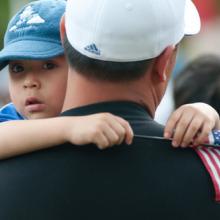 Nelson Navidad holds his son at a 2009 immigration rally. RyanRoderickBeiler.c /
