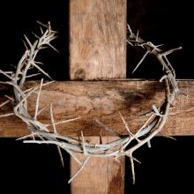 Crown of thorns hung around Easter cross, Anneka/Shutterstock.com