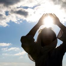 Young woman meditating, Luna Vandoorne / Shutterstock.com