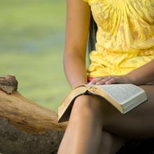 Woman reading Bible, Jacob Gregory / Shutterstock.com
