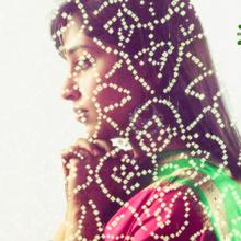 Woman behind veil praying, © Blend Images / Shutterstock.com