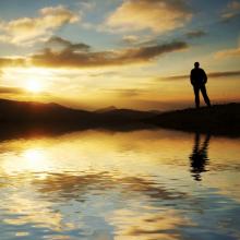 Silhouette of man in front of sunset, Galyna Andrushko / Shutterstock.com