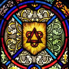 Stained glass window representing the Trinity, Nancy Bauer / Shutterstock.com