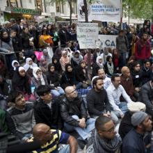 Imam leads muslims in a sermon at Occupy Wall Street by Lev Radin/Shutterstock.
