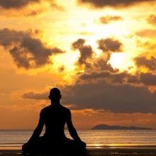 Meditating silhouette, aragami12345s/Shutterstock.com