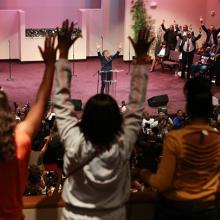 Rev. Al Sharpton speaks at Greater Grace Church in Florissant on Sunday. Image v