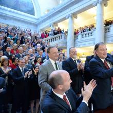 Utah Gov. Gary Herbert displays Senate Bill 296 after signing it into state law.