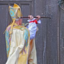 New Bishop of Durham knocking on door at Saturday's ceremony. Image from durham.