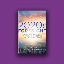 The cover of the book "2020s Foresight" shows the sky at sunrise and a city beneath it.