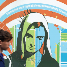 The image shows a mural of Sinead O'Connor, with the words "Sinead you were right all along. We were wrong. So sorry." 