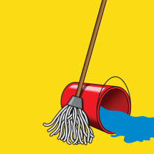 A mop stands next to a red bucket of water that is tipped over and spilling water.