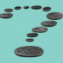 Illustration of round, flat stones in the shape of a question mark