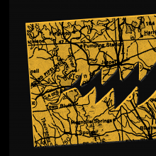 A map is cut out to look like a pac man with chomping, sharp teeth.