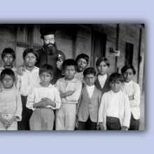 In this vintage photo, a bishop of a church stands among Indigenous children, a scene from 'Exterminate All the Brutes.'