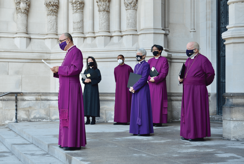 Photo of a gathering of Episcopal leaders outside St. John the Divine Cathedral.