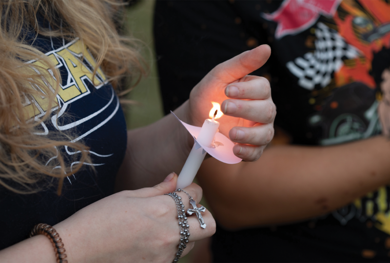 People gather at Apalachee High School in Winder, Ga., after a 14-year-old student killed four people and injured at least nine more.