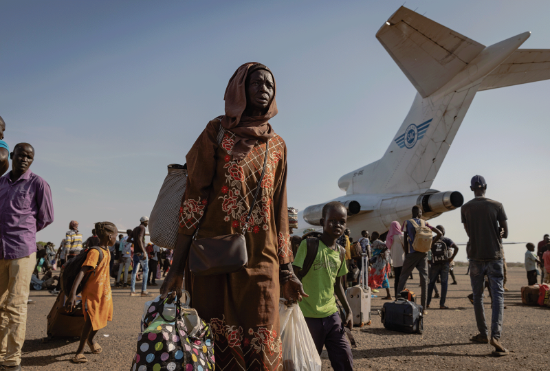 The photo shows South Sudanese refugees coming home after being displaced by war. 