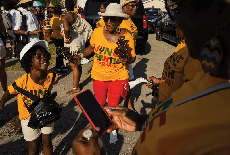 Joyful Black people of all ages gather outdoors in Juneteenth Celebrate! t-shirts