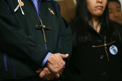 Cross emblems handed out to those who are fasting. Photo: Brandon Hook/Sojourners