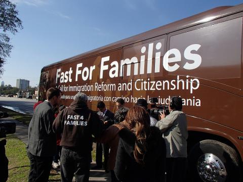 Fasters prayers in front of Rep Ted Poe's office outside the bus near Houston, Texas. Fast for Families/Flickr Fast for Families/Flickr