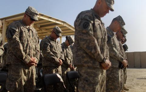 Soldiers pray, preparing to depart Iraq in December 2011. Mario Tama/Getty Images Mario Tama/Getty Images