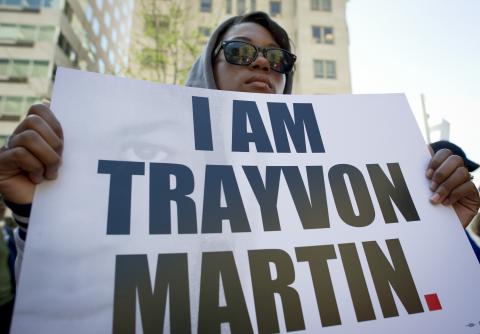 A protester carries a poster reading' I am Trayvon Martin' during a rally in Washington DC. MLADEN ANTONOV/AFP/Getty Images MLADEN ANTONOV/AFP/Getty Images