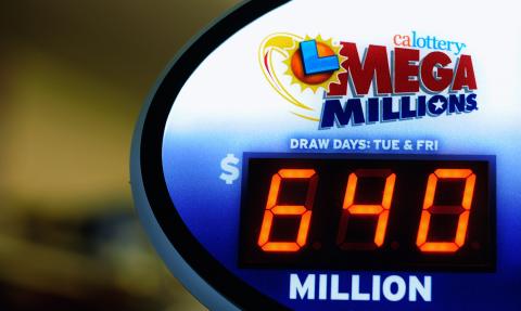 A sign displays the $640 Mega Millions jackpot at Liquorland on March 30 in California. Photo by Kevork Djansezian/Getty Images Photo by Kevork Djansezian/Getty Images