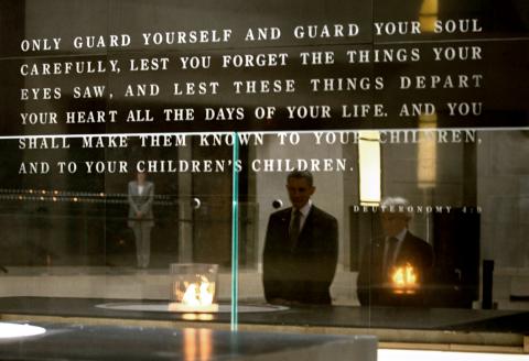 President Barack Obama and Elie Wiesel reflected in a wall in the Hall of Remembrance. BRENDAN SMIALOWSKI/AFP/Getty Images BRENDAN SMIALOWSKI/AFP/Getty Images