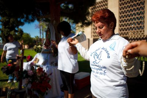 A group of protesters opposed SB 1070 at a vigil at the Arizona state Capitol. Jonathan Gibby/Getty Images Jonathan Gibby/Getty Images