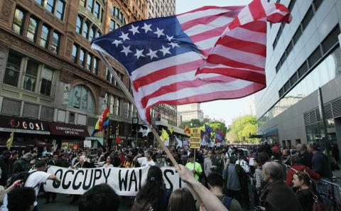 #OWS protesters march in lower Manhattan on Tuesday. Photo by Mario Tama/Getty Images Photo by Mario Tama/Getty Images