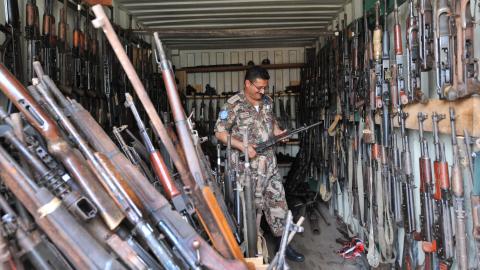 A soldier of the UN Operation in Ivory Coast checks weapons seized. SIA KAMBOU/AFP/GettyImages SIA KAMBOU/AFP/GettyImages