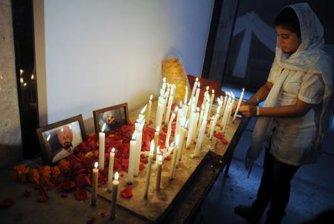 Indian Sikhs place flower petals and candles near pictures of those killed on Sunday. PUNIT PARANJPE/AFP/GettyImages PUNIT PARANJPE/AFP/GettyImages