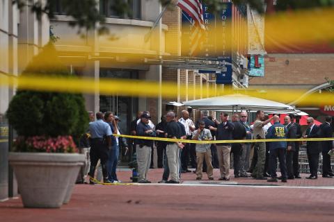 Local and federal investigators work to gather evidence outside FRC headquarters. Photo by Chip Somodevilla/Getty Images Photo by Chip Somodevilla/Getty Images