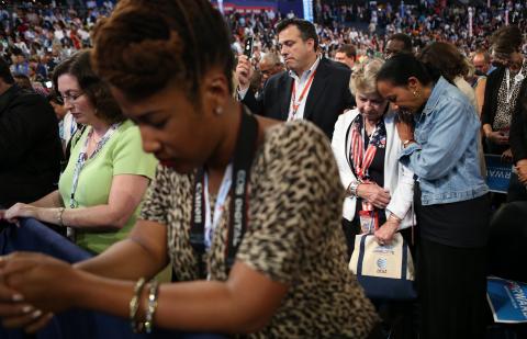 People pray during the Democratic National Convention. Chip Somodevilla/Getty Images Chip Somodevilla/Getty Images