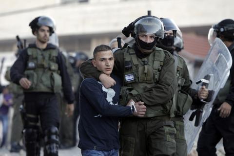 Israeli forces arrest a Palestinian youth during clashes in Arab Jerusalem Issawiya.AHMAD GHARABLI/AFP/Getty Images AHMAD GHARABLI/AFP/Getty Images