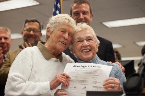 Couple holds up the first same-sex marriage license in Washington state on Dec. 6. David Ryder/Getty Images David Ryder/Getty Images
