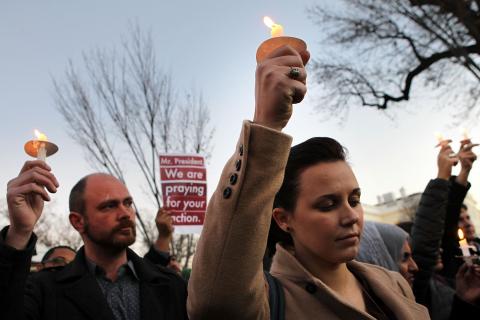 Julie Henson of San Francisco joins other people outside the White House to remember shooting victims. Alex Wong/Getty Images Alex Wong/Getty Images