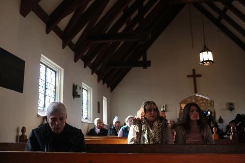 People attend a prayer service to reflect on the violence at the Sandy Hook School. Spencer Platt/Getty Images Spencer Platt/Getty Images